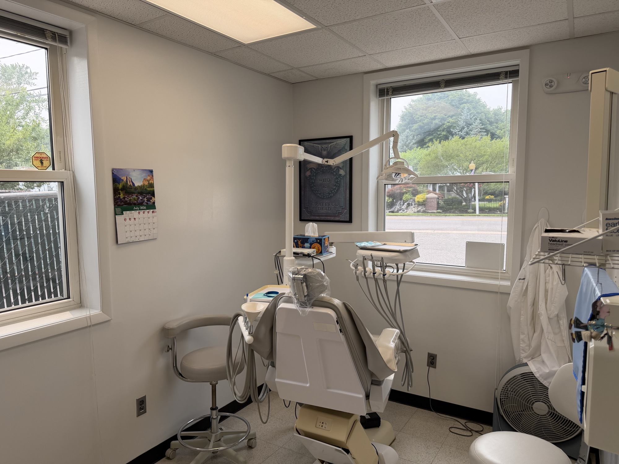 A treatment room at All Island Dentistry, chair beside a window looking onto Hawkins Ave