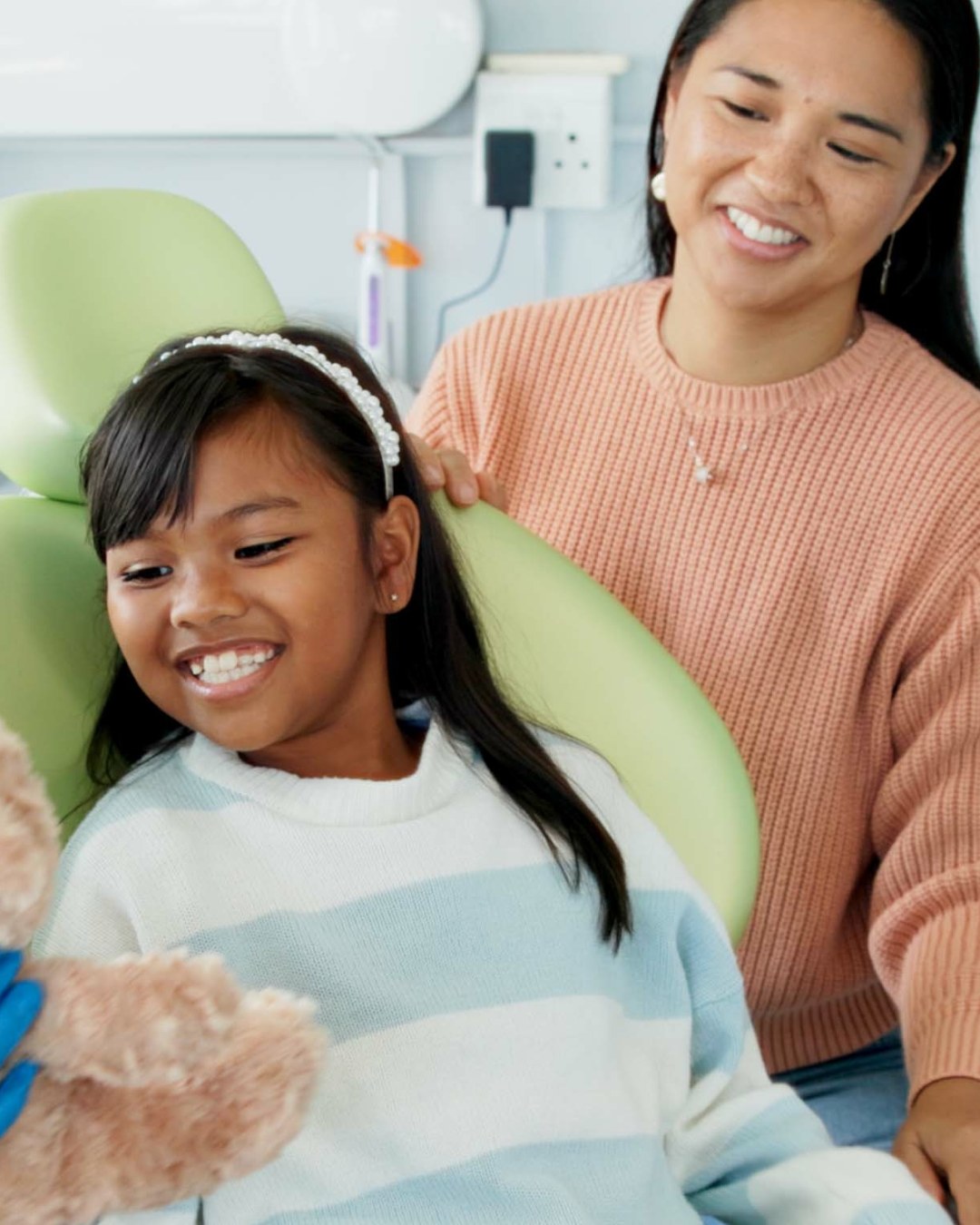A child and a parent at a dental check-up